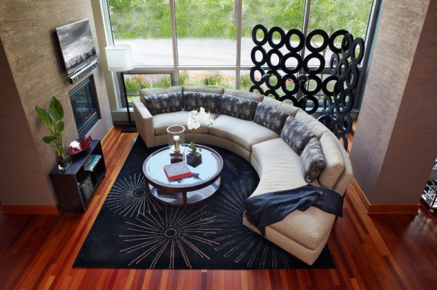curved-sofa-around-the-tv-fireplace