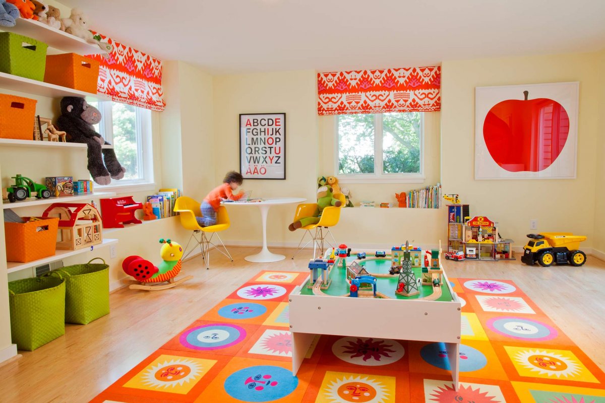 Geometric-and-floral-mat-in-brightly-colored-childs-playroom