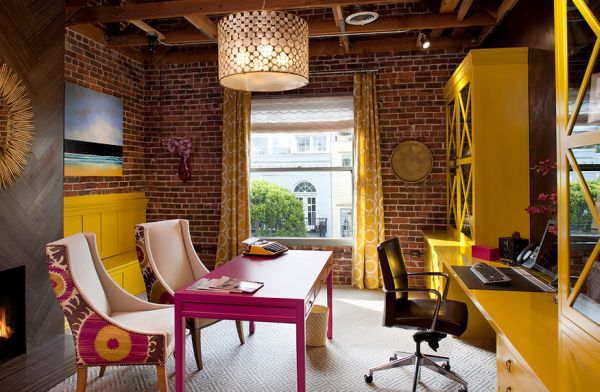 Home-office-sports-exposed-brick-walls-along-with-shades-of-fuchsia-and-yellow
