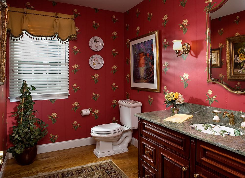 Flowery-wallpaper-with-lots-of-red-is-perfect-for-the-classic-and-playful-Victorian-powder-room