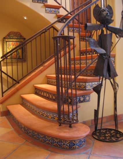 bright-mediterranean-staircase-orange-floor-tiles-stairs-with-simple-railing-steel