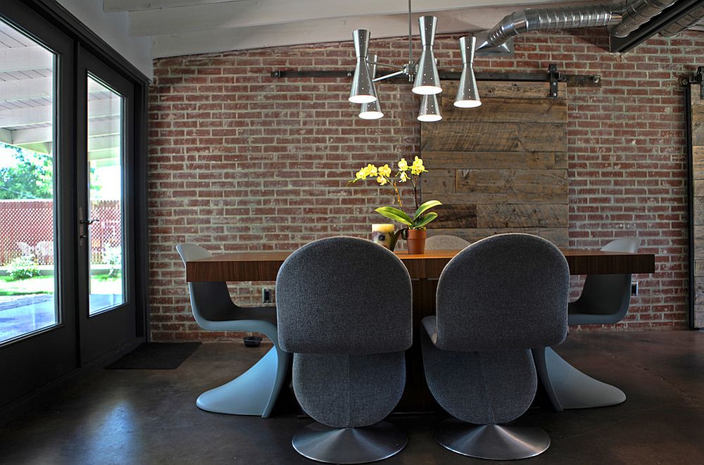 Industrial-dining-room-with-brick-wall-and-sliding-barn-door