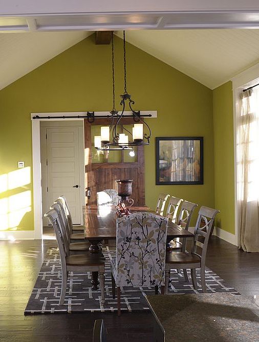 Modern-dining-room-in-green-with-sliding-barn-door