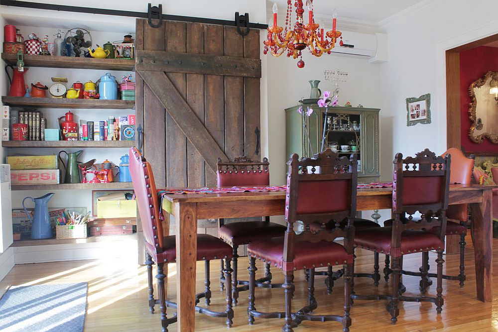 Reclaimed-barn-door-in-the-dining-room-hides-a-large-shelf