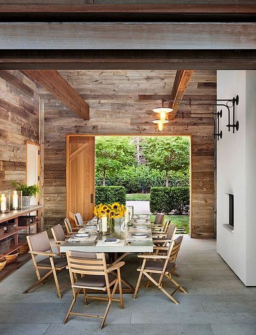 Rustic-dining-room-utilizes-space-saving-sliding-barn-door