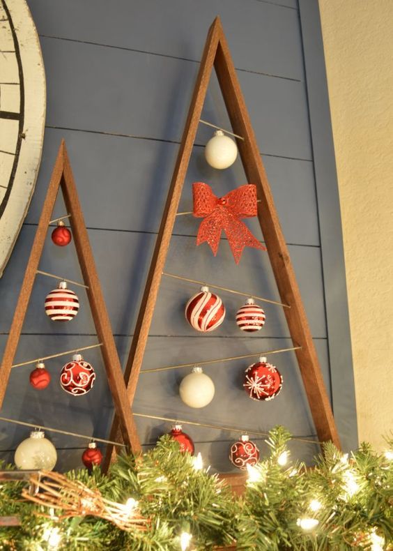 reclaimed-wood-plank-christmas-trees-with-ornaments-hanging-inside