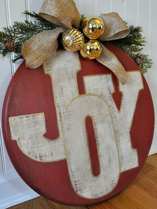 red-ornament-joy-sign-with-gold-ornaments-and-a-burlap-bow