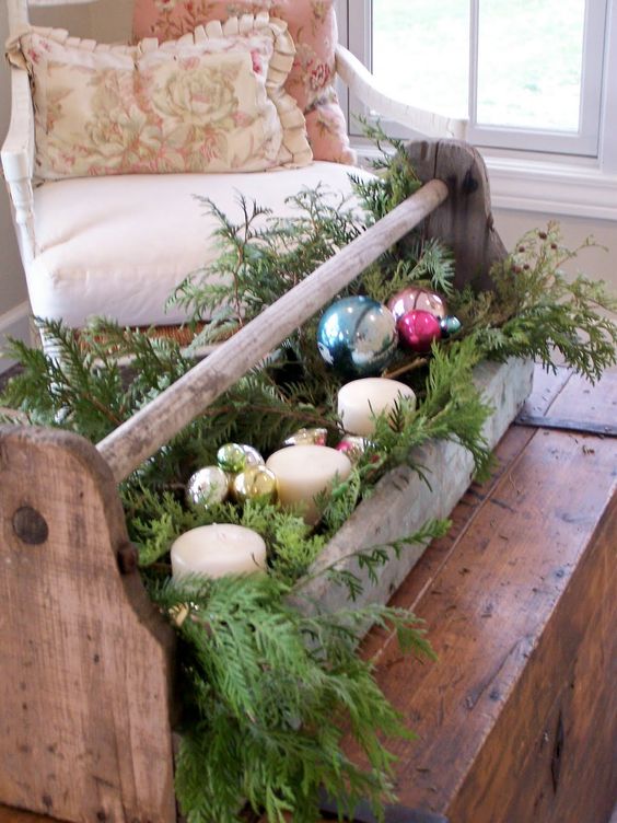 vintage-toolbox-repurposed-for-holiday-decor-with-fir-branches-candles-and-ornaments