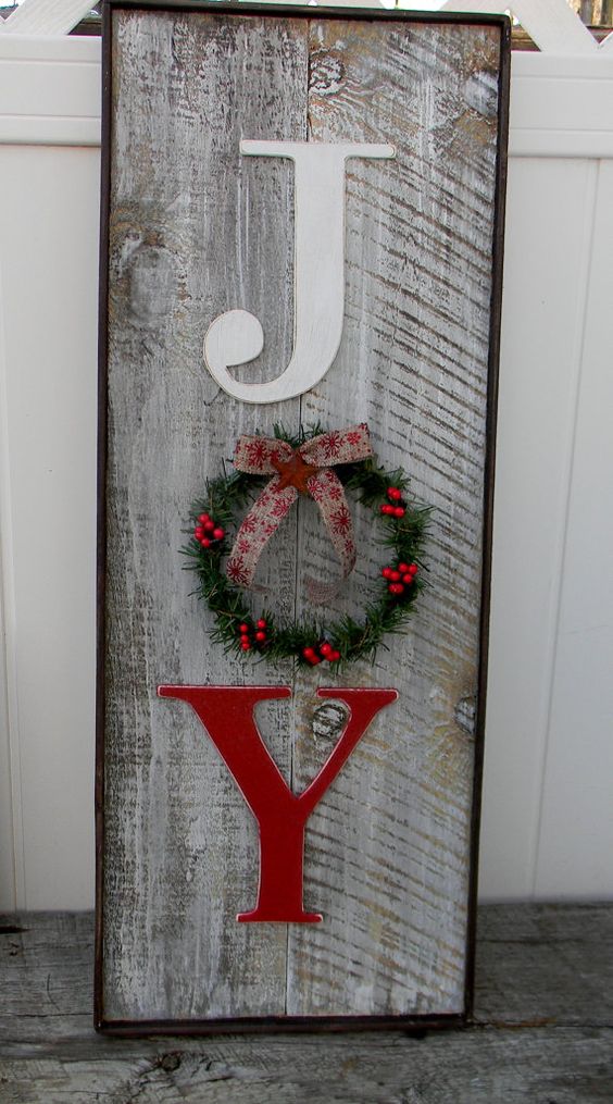 weathered-wooden-joy-sign-with-a-small-wreath